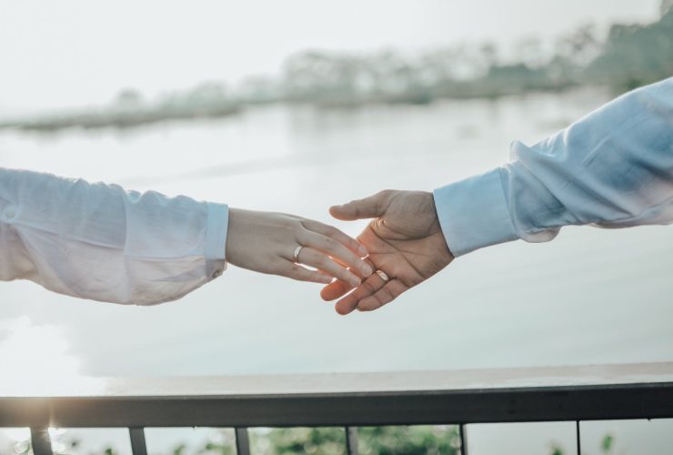 man and woman holding hands