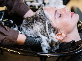 person washing woman s hair