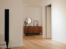 black tower speaker beside white wall