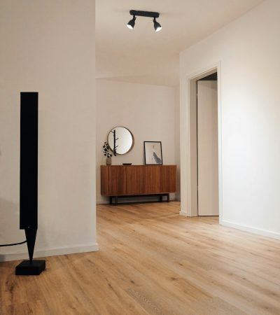black tower speaker beside white wall