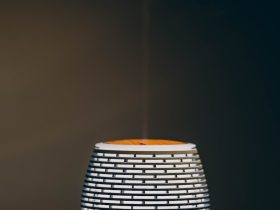 a white cup with steam rising out of it