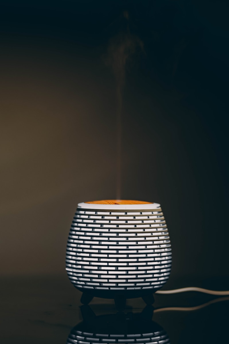 a white cup with steam rising out of it
