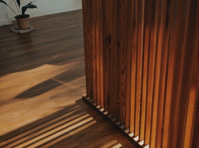 brown wooden staircase with brown wooden railings