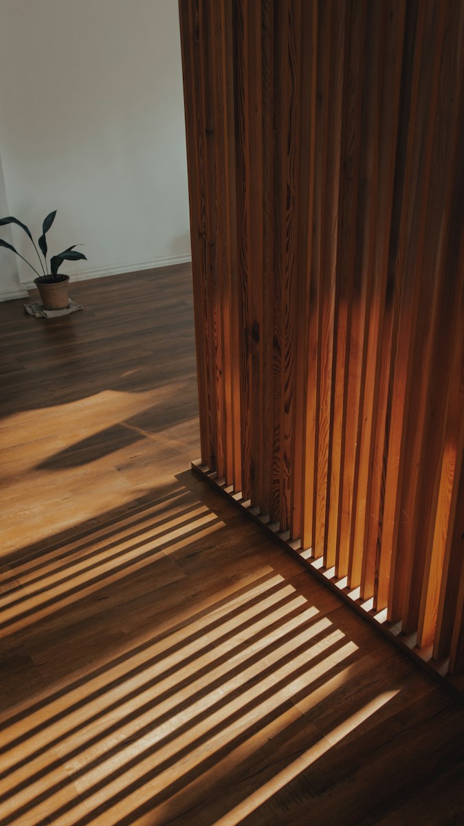 brown wooden staircase with brown wooden railings